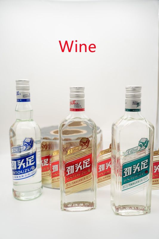 Papier autocollant transparent imprimable pour étiquette de bouteille de vin Des modèles et des formes personnalisés disponibles